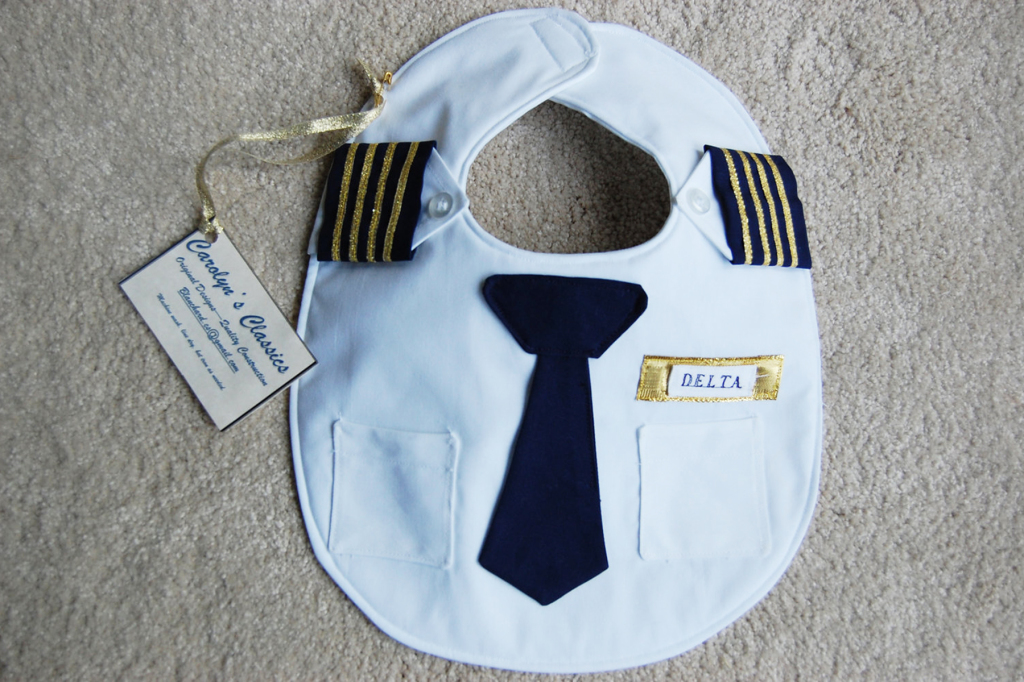 Truly adorable and one of a kind baby bib for your little captain! Each bib can be customized to feature the airline of choice and is handmade and authentic. Every baby needs the proper uniform when the airplane comes into land. 